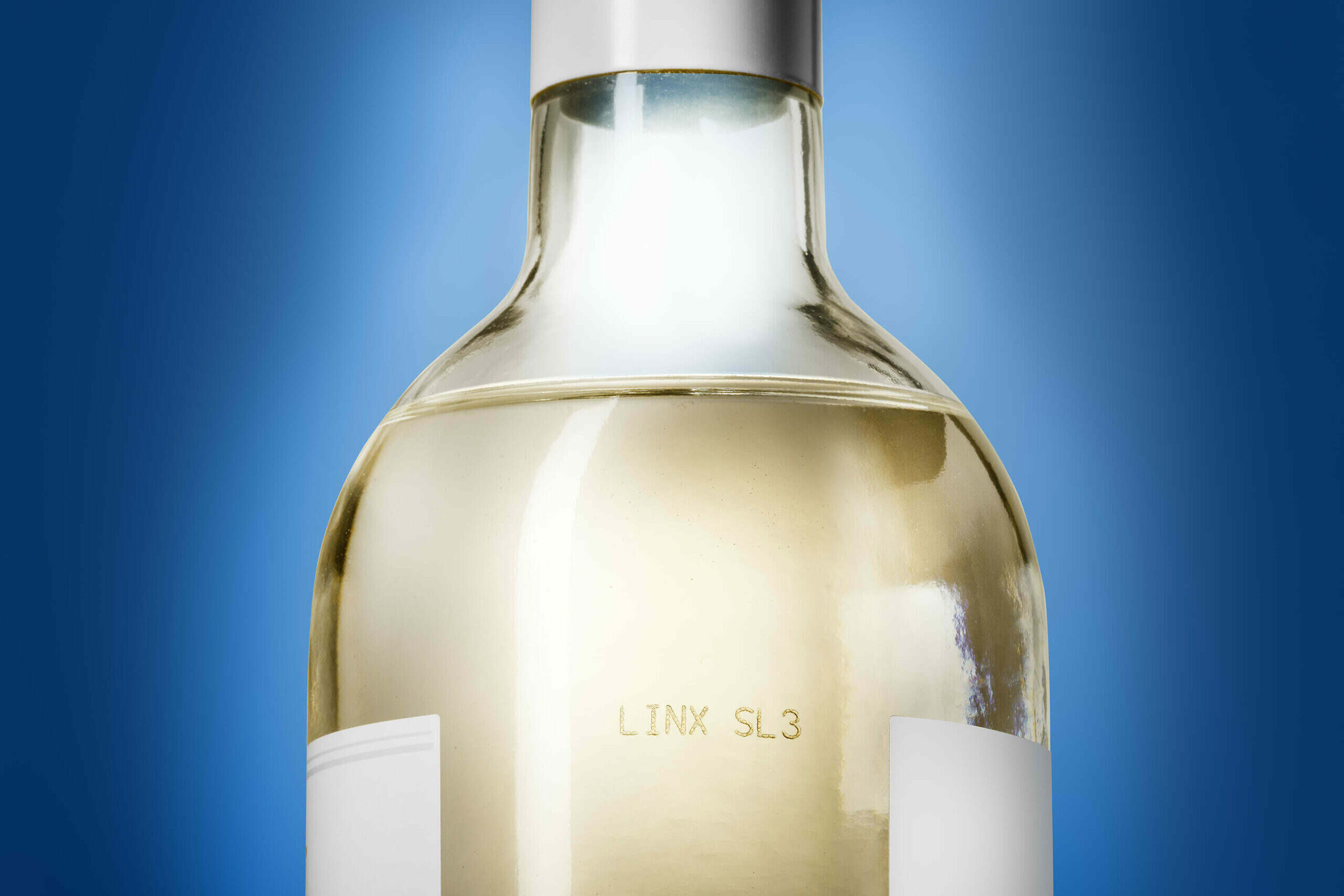 Lasermaskin Linx SL3 lasergravering på glasflaska